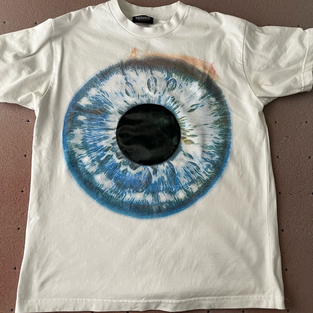 Menace White T-Shirt with Large Blue Eye Graphic